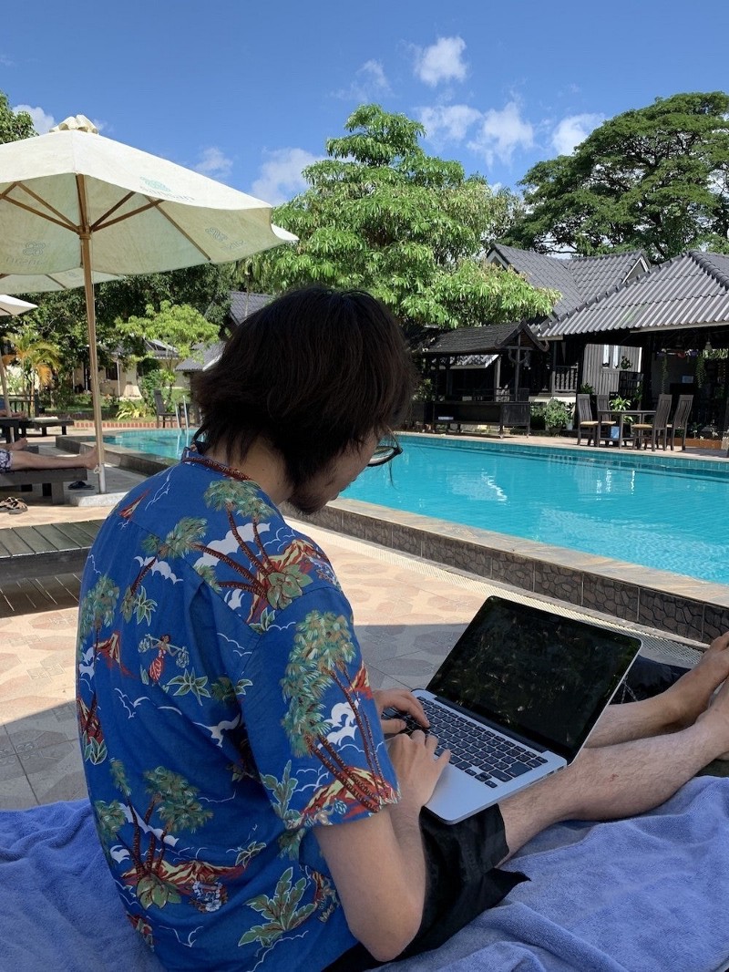 Coding even at the poolside in Laos